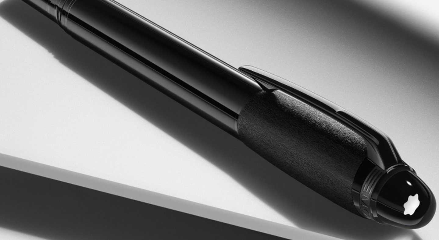 A Montblanc StarWalker pen on a grey background.